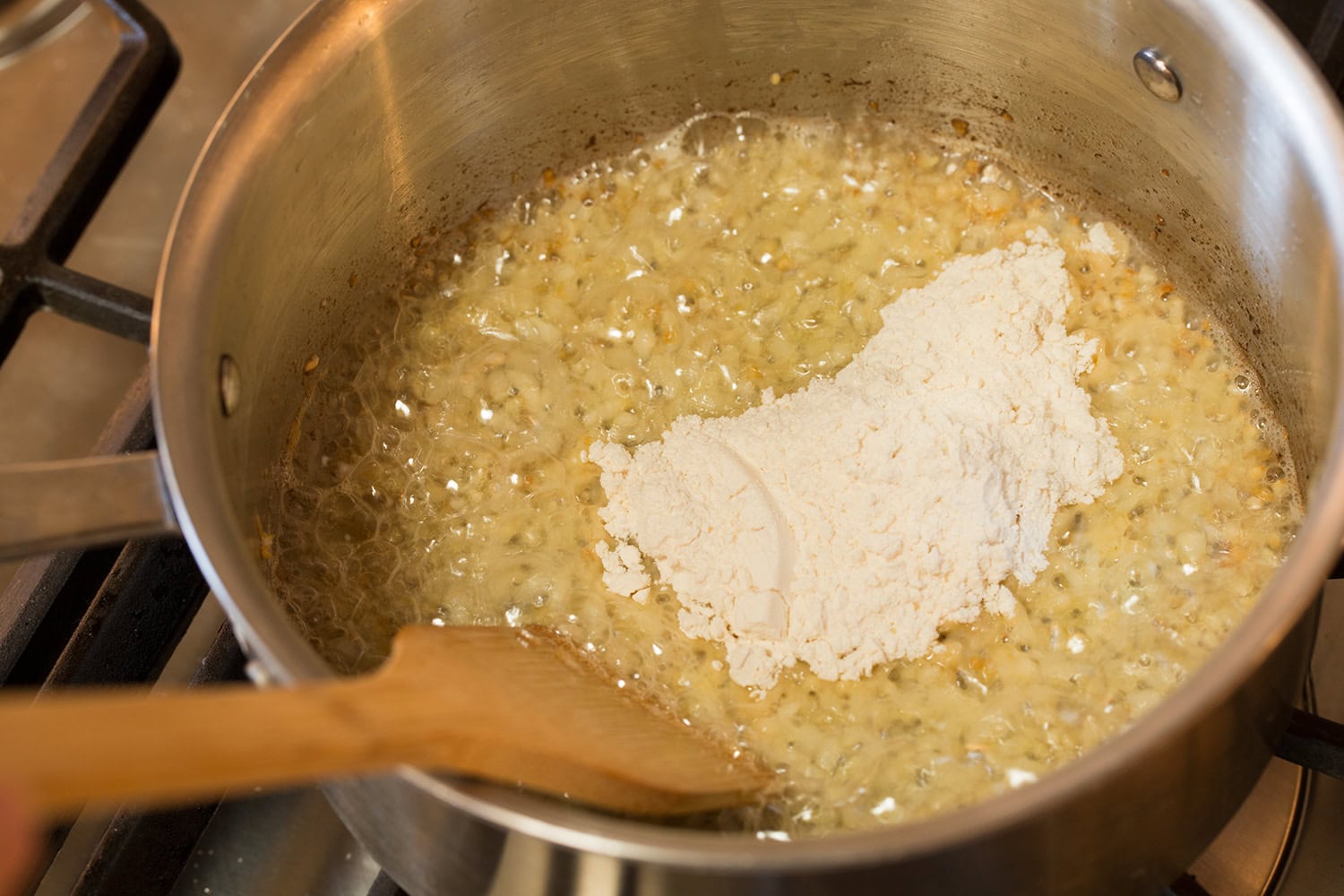 Funeral Potatoes Flour added to sauteed onions in butter.