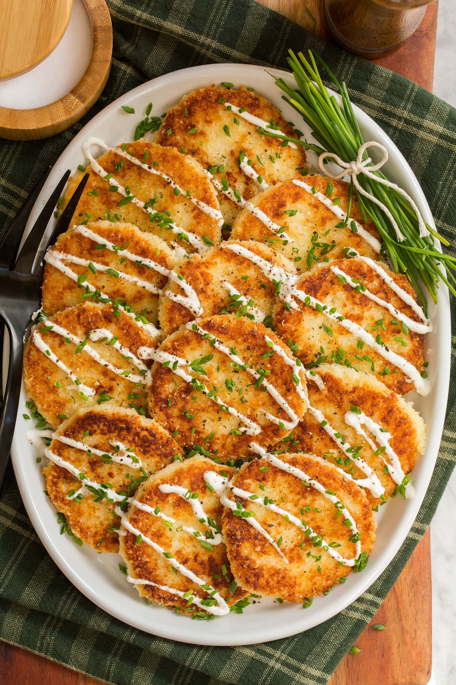 Mashed Potato Cakes Overhead photo mashed potato cakes layered overlapping on a platter.