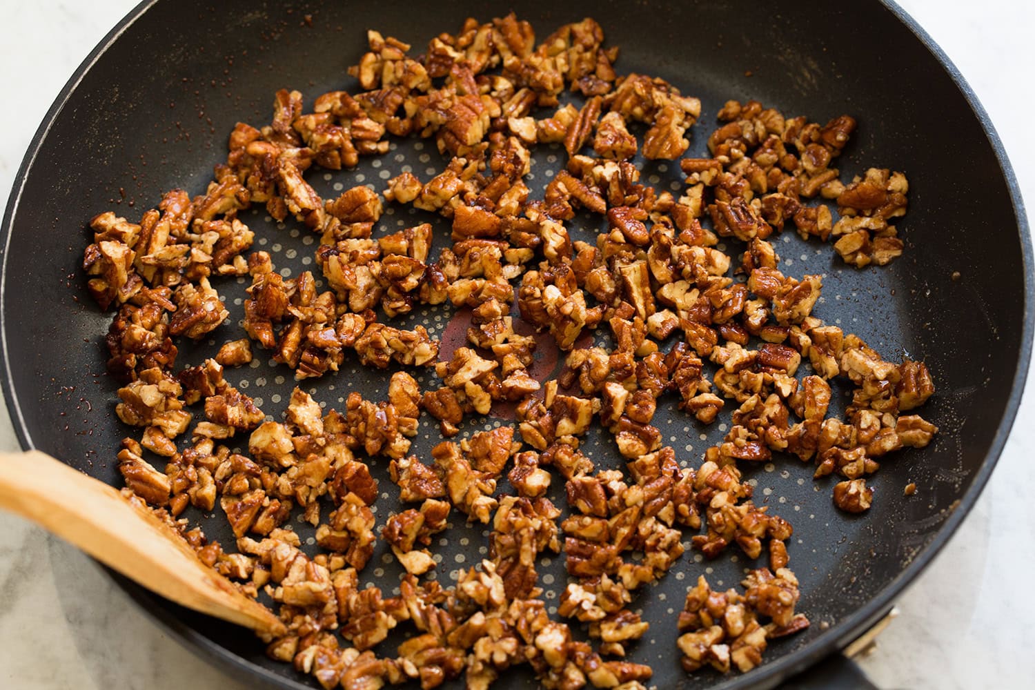 Sweet Potato Salad Maple candied pecans in a non-stick skillet.