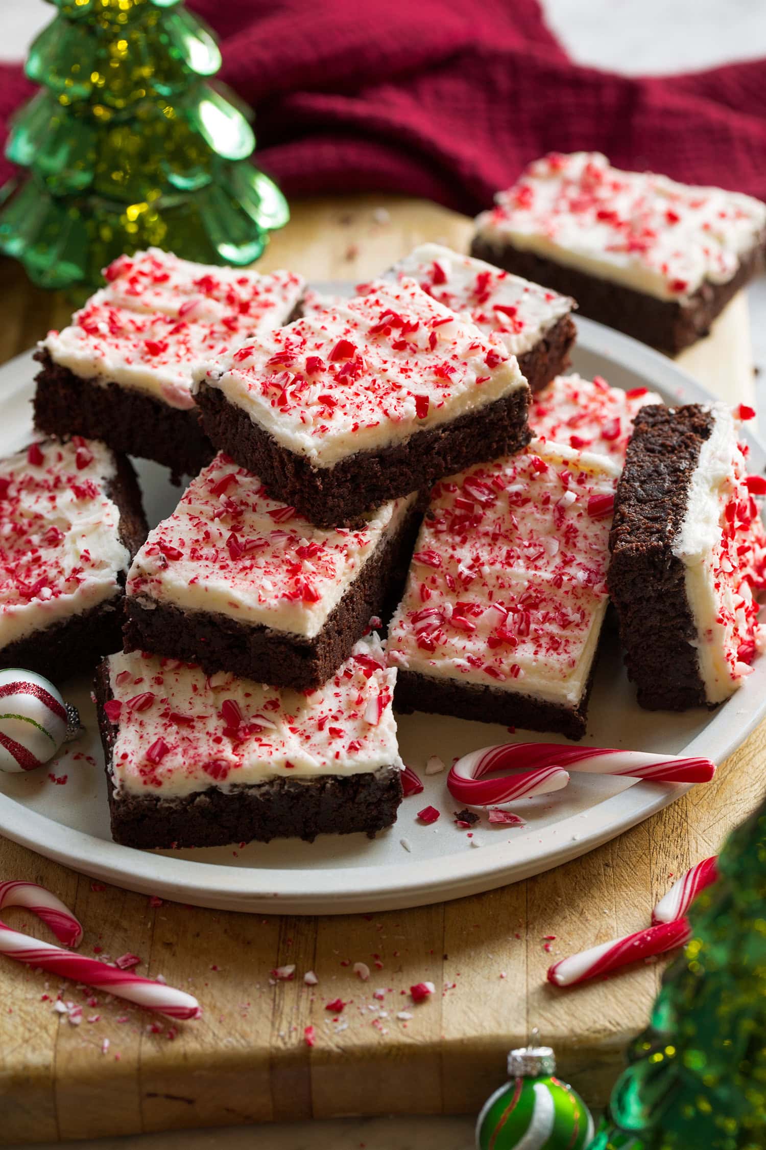Plate of stacked frosted peppermint brownies.