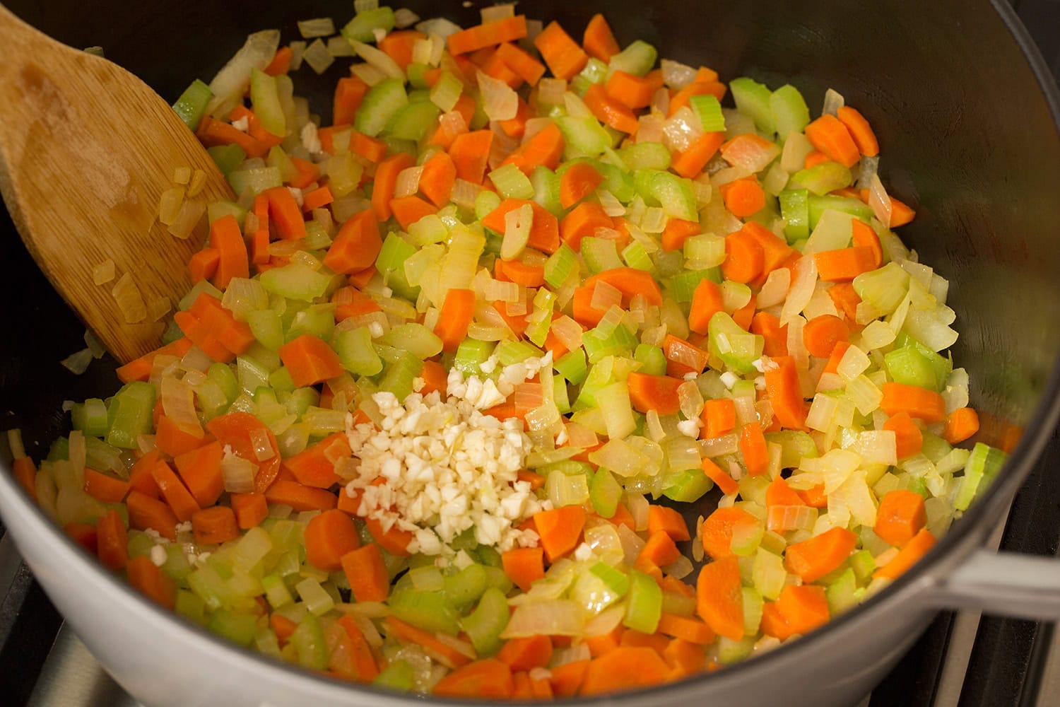 Turkey Soup Vegetables sauteed in pot.