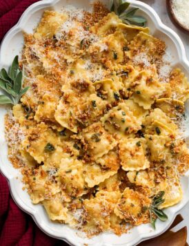 Browned butter sage sauce over ravioli pasta.