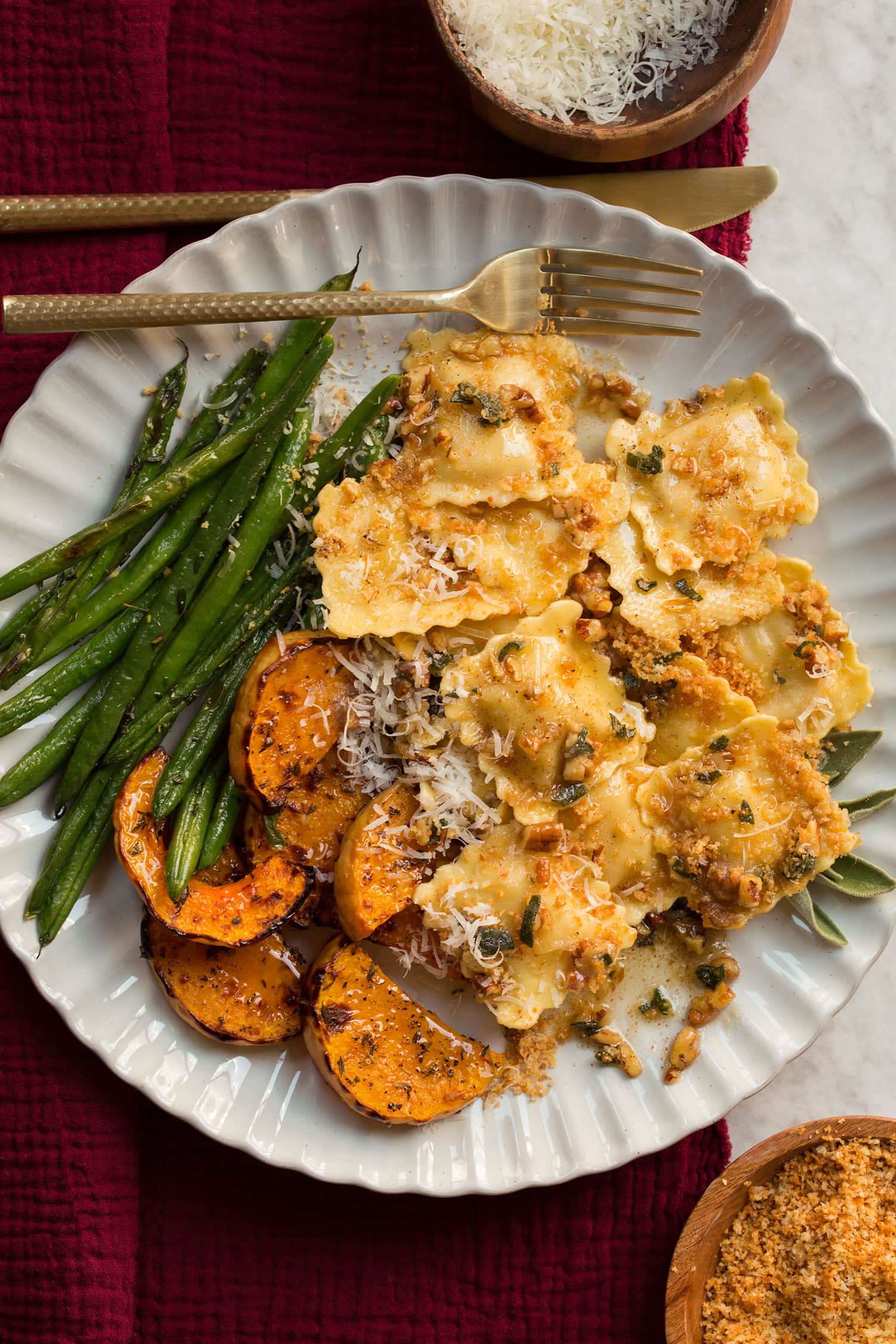 Ravioli with Browned Butter and Sage Sauce Browned butter sage sauce on ravioli with green beans and butternut squash.