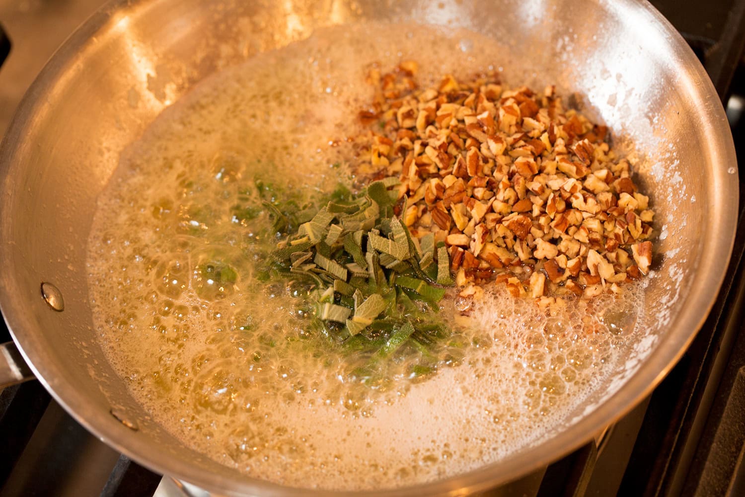 Sage and pecans added to browning butter.