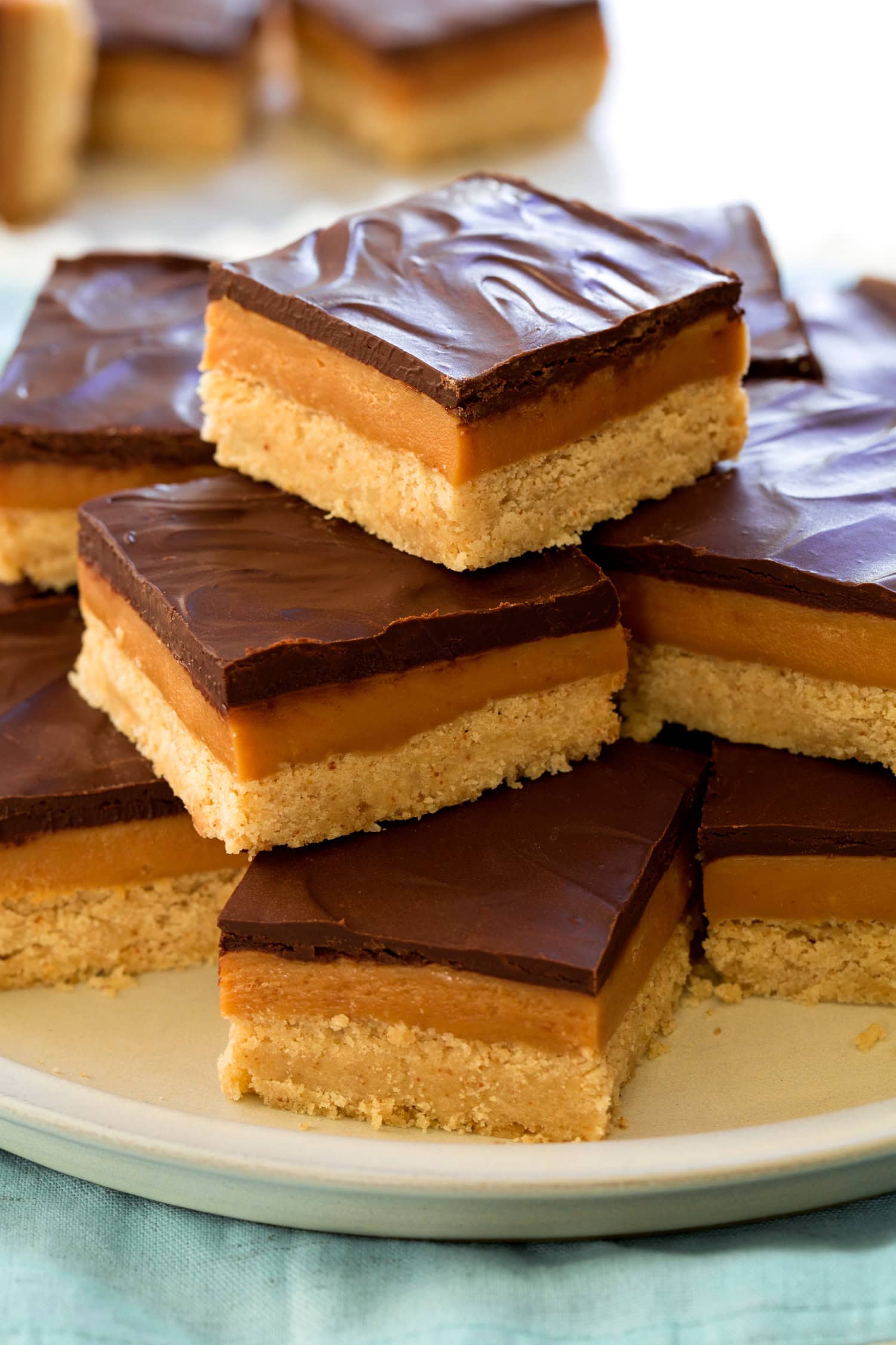 Close up photo of millionaire's shortbread bars showing 3 layers and their texture.