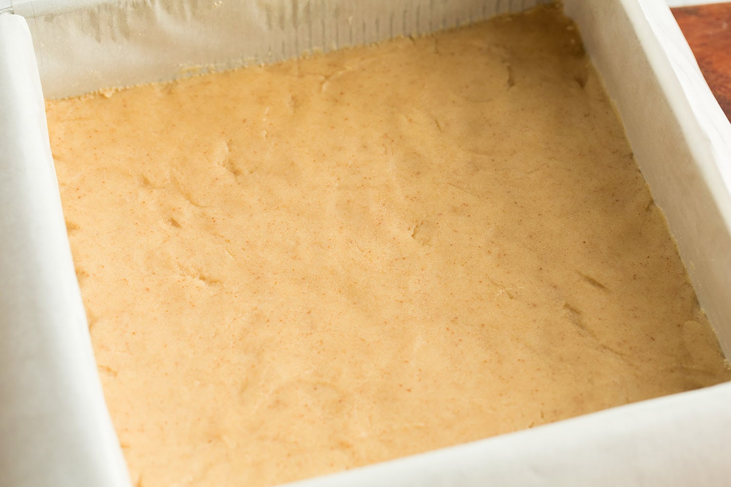 Browned butter dough pressed into baking pan.