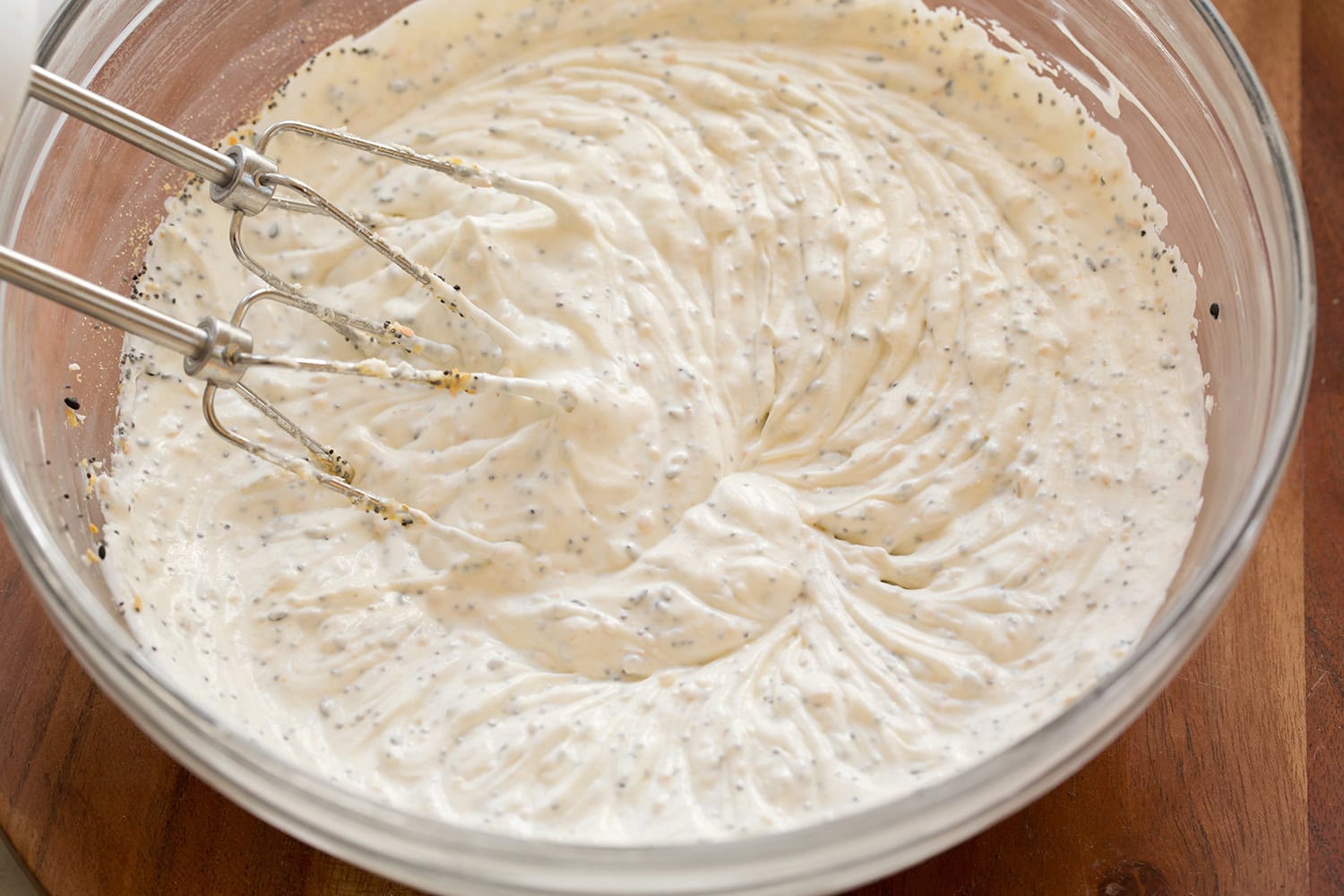 Completed dip mixture shown in glass mixing bowl.