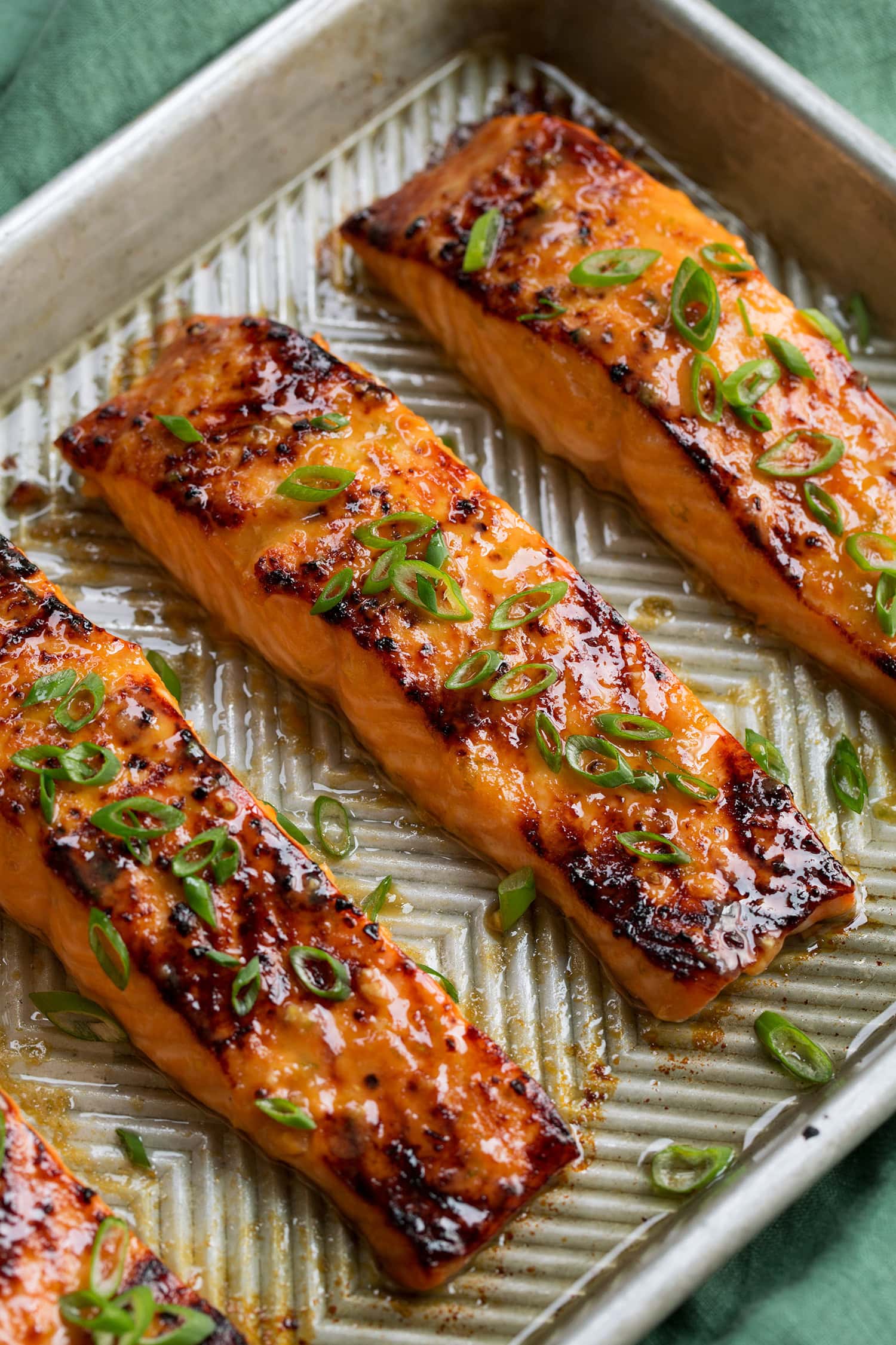 Miso marinated salmon broiled and garnished with green onions.