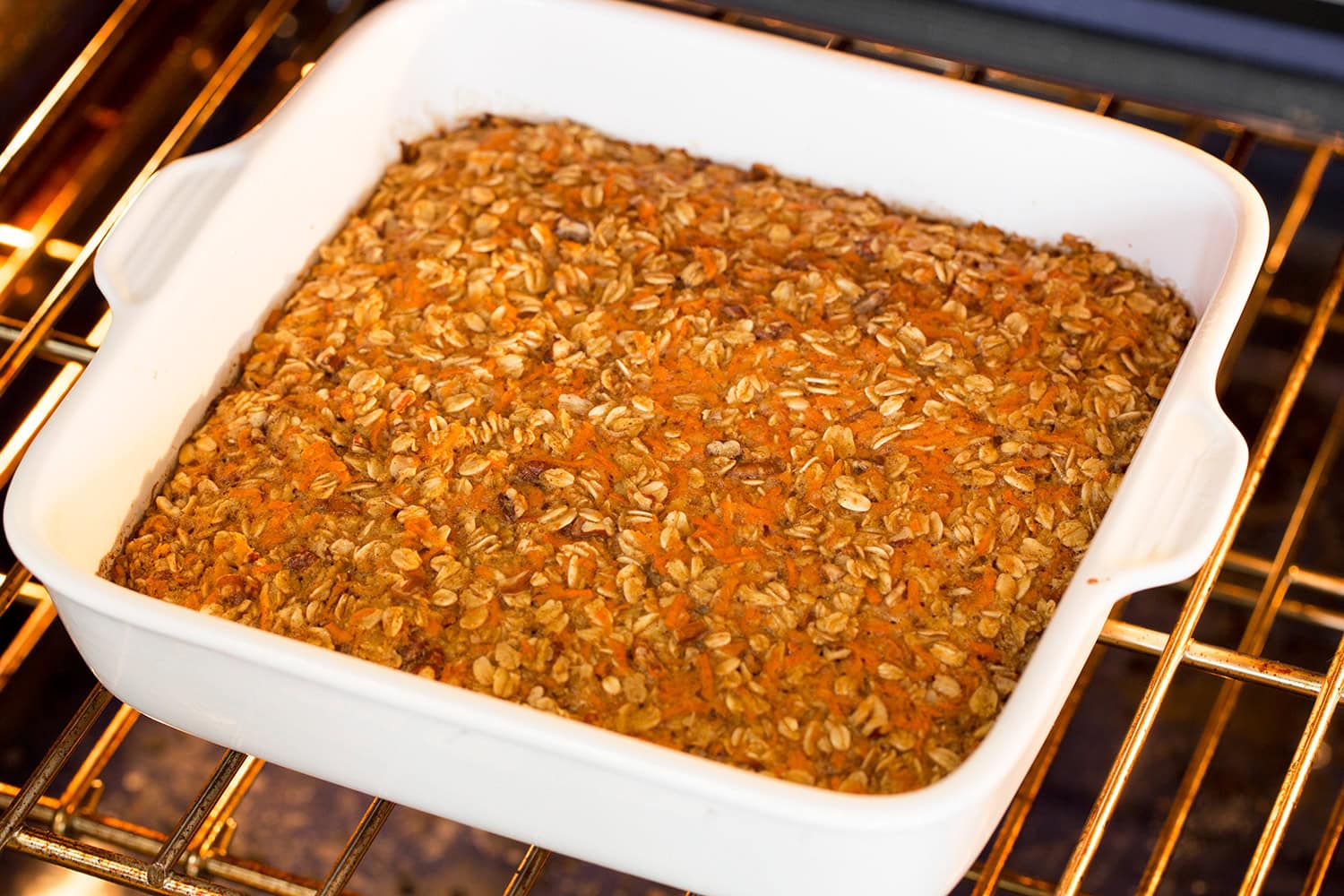Baked carrot cake oatmeal in oven shown bakd.