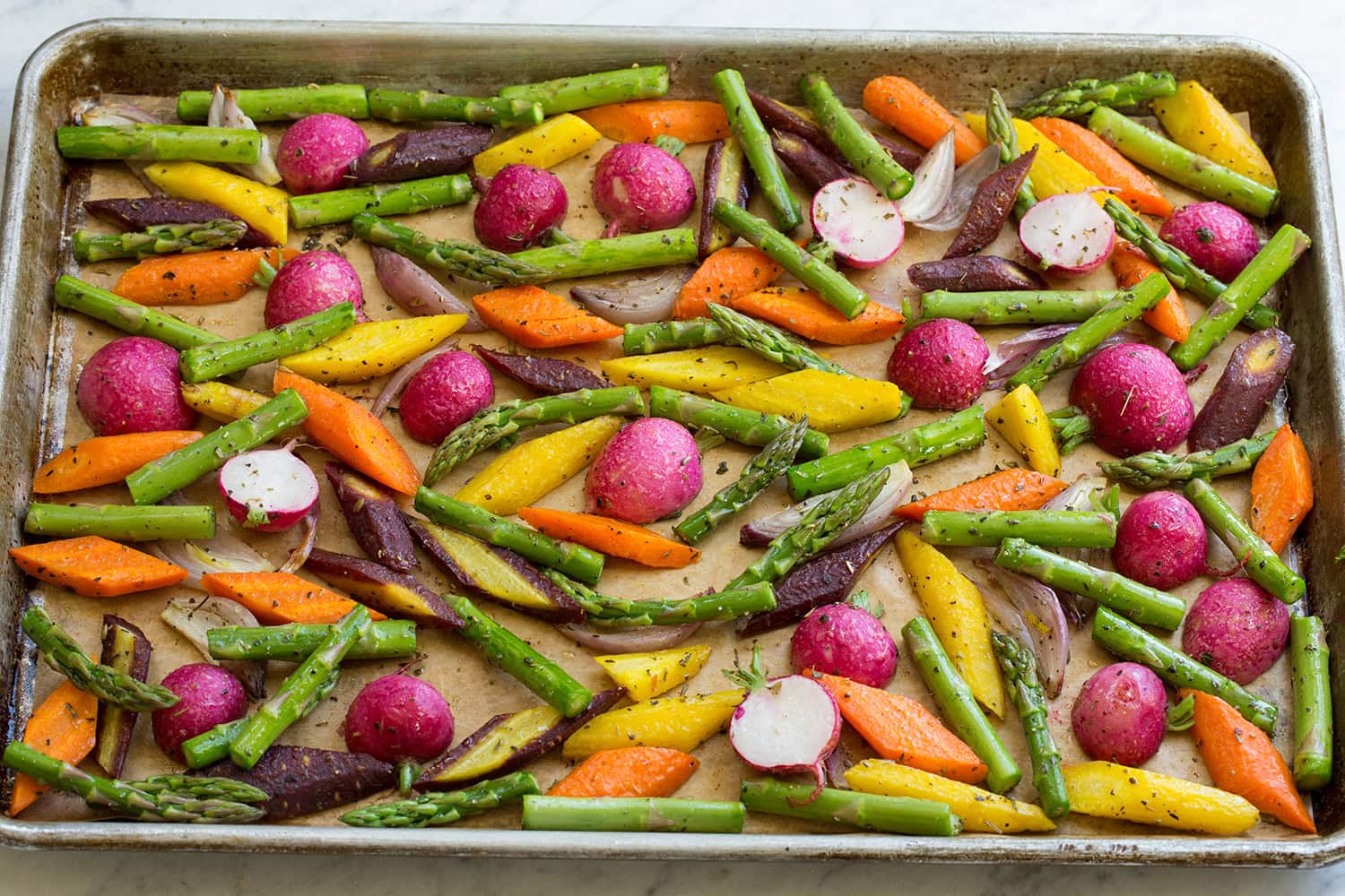 Asparagus added halfway to roasted vegetables.