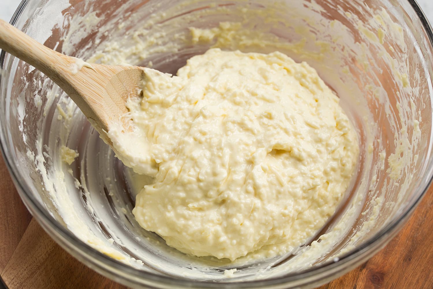 Brazilian Cheese Bread (Pão de Queijo) Cheese folded into the tapioca flour cheese bread mixture.
