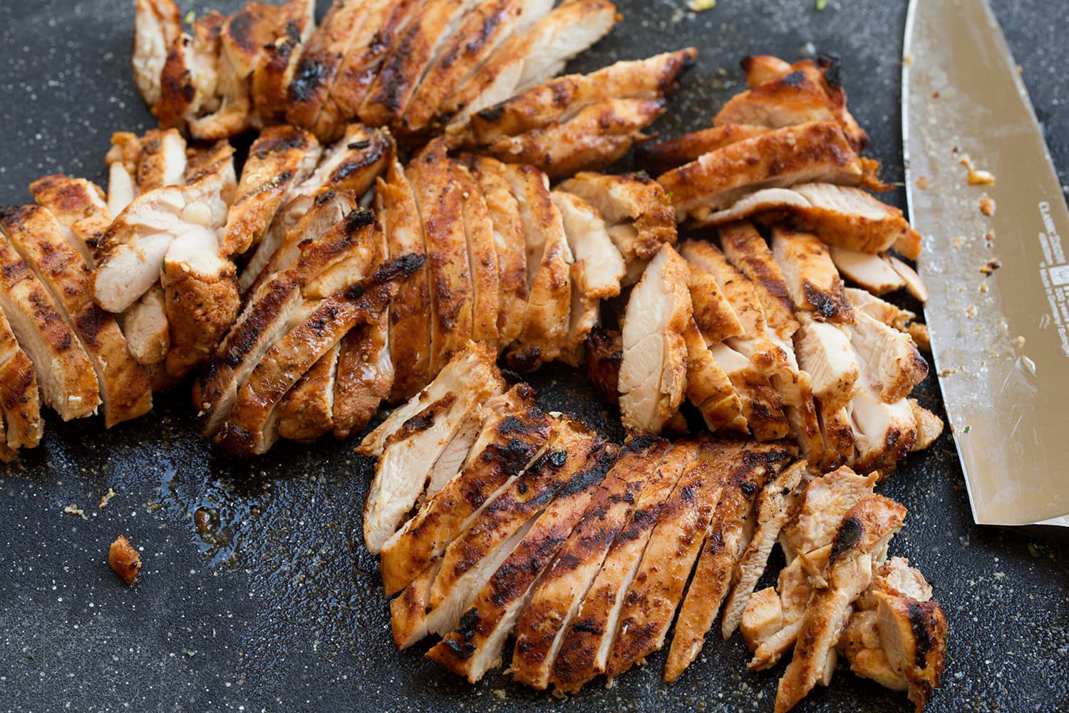 Street Corn Chicken Rice Bowl Marinated grilled chicken shown chopped.